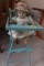 MINIATURE HIGH CHAIR WITH ANTIQUE DOLL