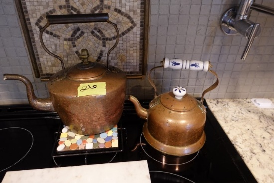 TWO COPPER TEA KETTLES AND MARBLE CUTTING BOARD