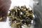 GLASS CANISTER FULL OF USED AMMO BRASS
