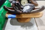 NATIVE AMERICAN IN CANOE ON STAND APPROX 12 INCH LONG