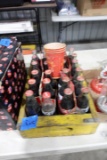 YELLOW WOODEN COCA COLA FULL OF COLLECTIBLE COCA COLA BOTTLES