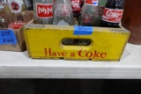 YELLOW WOODEN COCA COLA CRATE FULL OF COLLECTIBLE COCA COLA AND SODA BOTTLE
