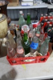 RED PLASTIC COCA COLA CRATE FULL OF COLLECTIBLE COKE AND SODA BOTTLES