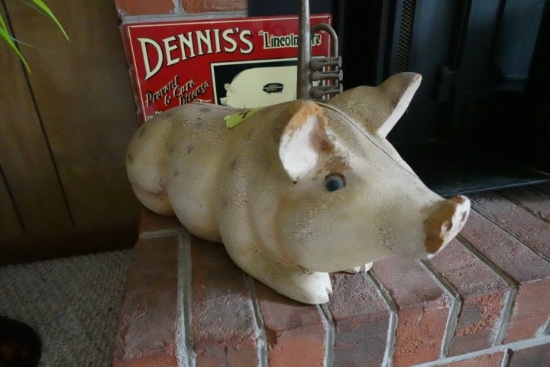 DECORATIVES ON FIREPLACE INCLUDING WOODEN PIG TOY TRUMPET AND DENNIS PIG PO