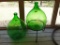 (2) Green Glass Bottles, (1) Wrought Iron Stand