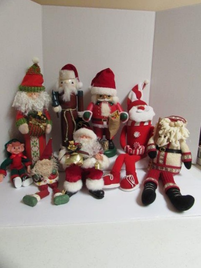 (7) Santa Claus Figures & (1) Elf Figure.