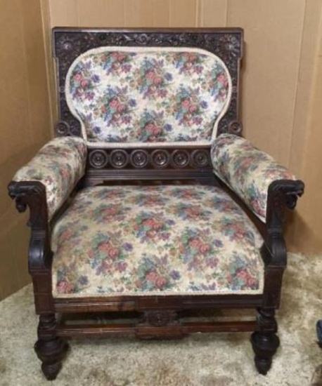 Antique Upholstered Arm Chair with Ornately Carved