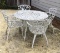 Round iron outdoor table and four matching
