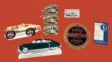 Assorted Vintage Car Advertisements and Parts
