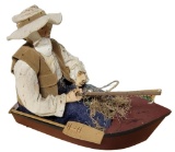 Fisherman in Boat Figurine