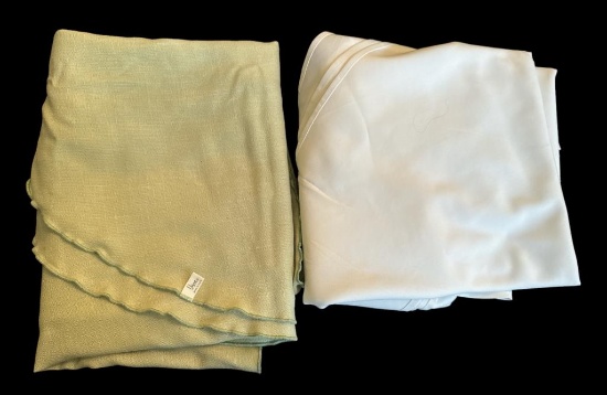 (2) Tablecloths: 90” White Round, Green Oblong