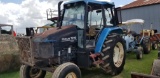 NEW HOLLAND TS110 TRACTOR W/LOGGER SPECIALS