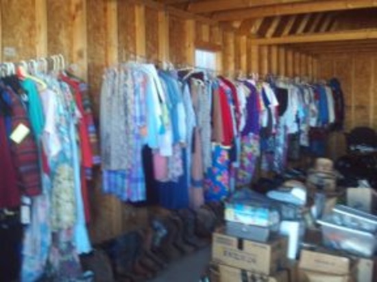 CLOTHES AND MISC ITEMS INSIDE STORAGE BUILDING