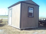 8X12 PORTABLE BUILDING WITH DOOR ON SIDE AND 2 WINDOWS NEXT TO HIGHWAY