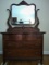 Antique Tiger Oak Dresser W/Attached Carved Mirror On Casters