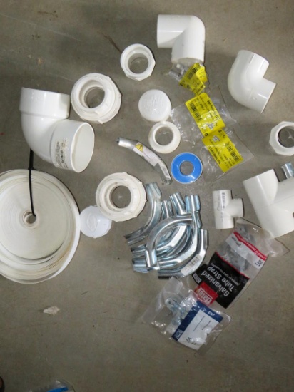 Various PVC Pieces & Roll Of Pipe Strap
