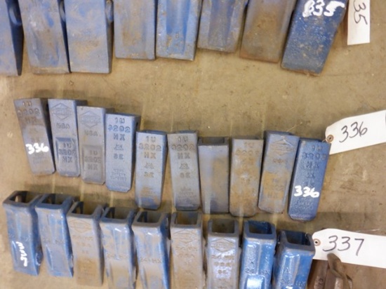 (10) UNUSED Bucket Teeth and (2) Shanks