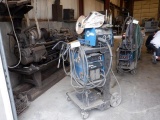 MILLER XMT 304 CC/CV DC Inverter Arc Welder, Miller 22A wire feed unit, gas bottle, and cart