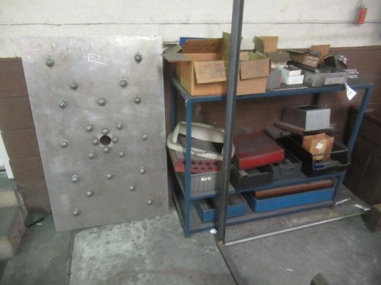 Blue Steel Rack and Contents, Roller Table Section, Steel Table, Green Steel Rack (along rear wall),