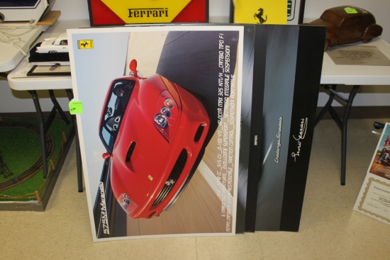 Group of five Ferrari posters on poster board