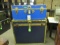 Black and blue travel trunk