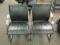 Two leather and chrome armchairs