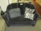 Black settee with two pillows