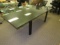 Glass top black lacquered dining table with four legs