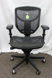 Black office chair, mesh seat and back, adjustable seat, back and arms