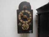 Weighted hand painted wall clock