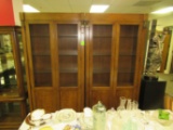 Pair of wood and glass shelved curio cabinets with brass medallions, 37-1/2