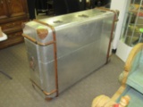 Aluminum clad trunk fitted with leather, wood and brass trim, 58