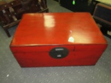 Red lacquered trunk with side handles, 36