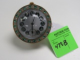 Swiss clock with bronze bezel and see through works