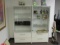 Two glass door and two-drawer display cabinets, 33