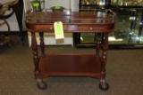 Serving cart with silver trim, marked Christofle Paris, hidden drawer and h