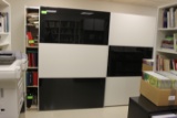 Two-door rolling storage cabinet with black and white doors