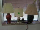 Three table lamps and a clamp on light