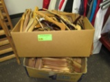 Two boxes of wooden hangers