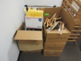 Six boxes of miscellaneous hangers and a clothes rack