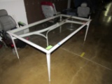 White outdoor patio set comprising table with glass top, 6' x 3', six chair
