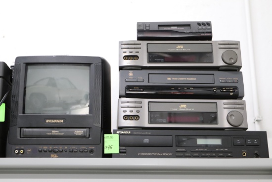 Electronics including an RCA 8mm cassette recorder, two JVC VCRs, GE VCR, Sansui compact disc pla...