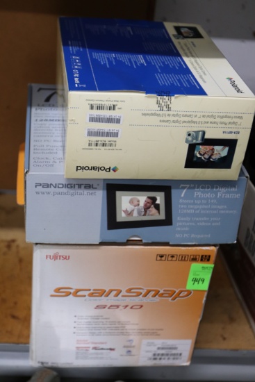 Two digital picture frames, Adobe Snap Scan S510, and a Panasonic transportable case model EBJ1112