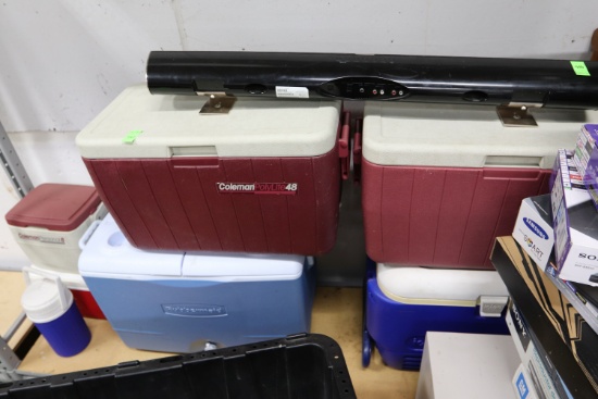 Four large coolers and three small coolers including two Coleman Polylite 48, Rubbermaid, and Igloo