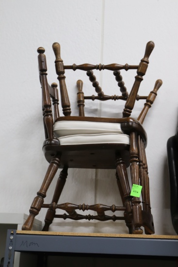 Four wooden chairs with white cushion