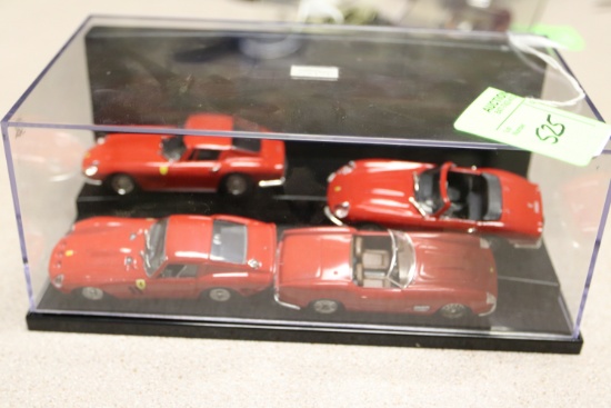 Group of four Ferrari diecast model cars including three Model Box and one Vitesse