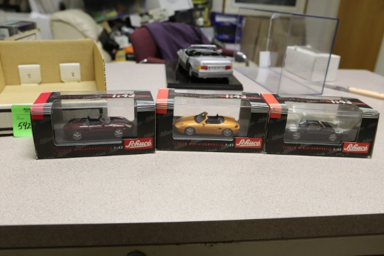 1:43 scale diecast cars including three Schuco Porsches