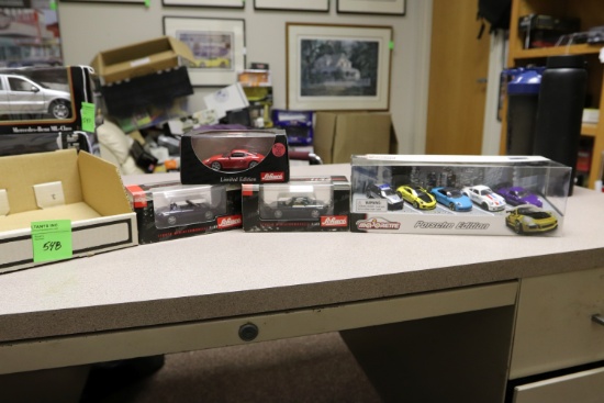 1:43 diecast cars including three Schuco Porsches and a Majorette Porsche Edition box set