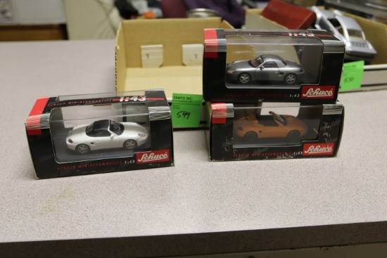 1:43 scale diecast cars including three Schuco Porsches
