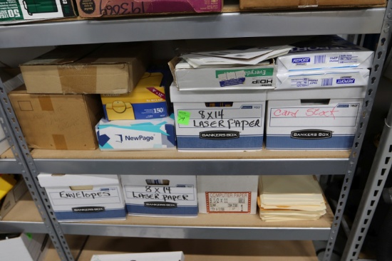 Two shelves of paper products, photo paper, manila envelopes, laser paper, cardstock, everything ...